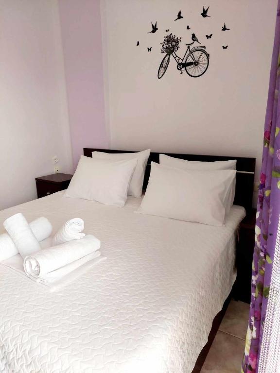 Postel nebo postele na pokoji v ubytování Nefeli Maisonette