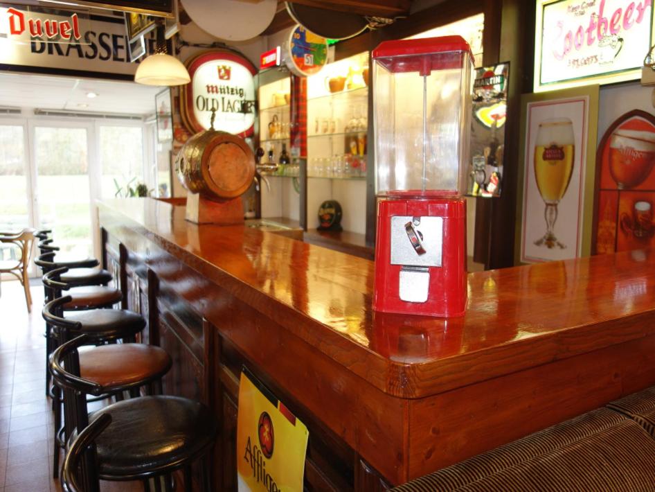 a bar with a red drink dispenser in a restaurant at Moulin des Prés - 15 couchages - 1h15 des Jeux Olympiques PARIS 2024 in Croissy-sur-Celle