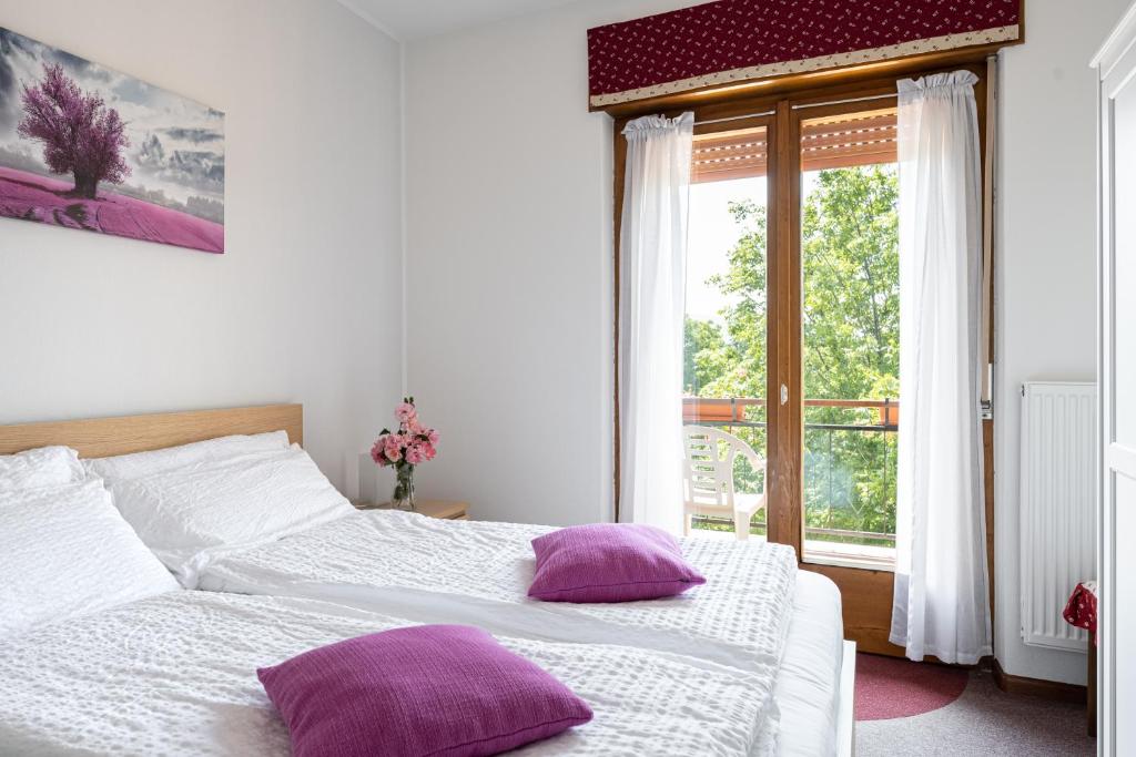 Postel nebo postele na pokoji v ubytování Piccolo Orso Bruno
