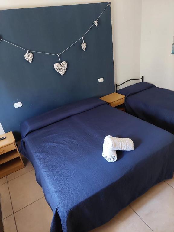 Postel nebo postele na pokoji v ubytování HOTEL OLIVER