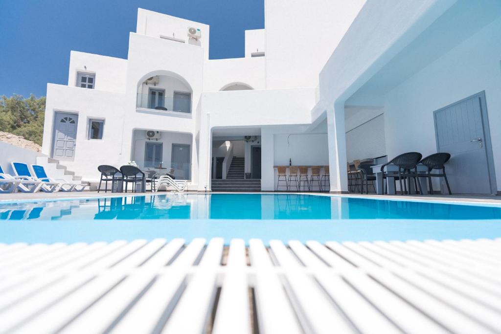 a view of the swimming pool of a villa at Dodomar Selection in Perissa