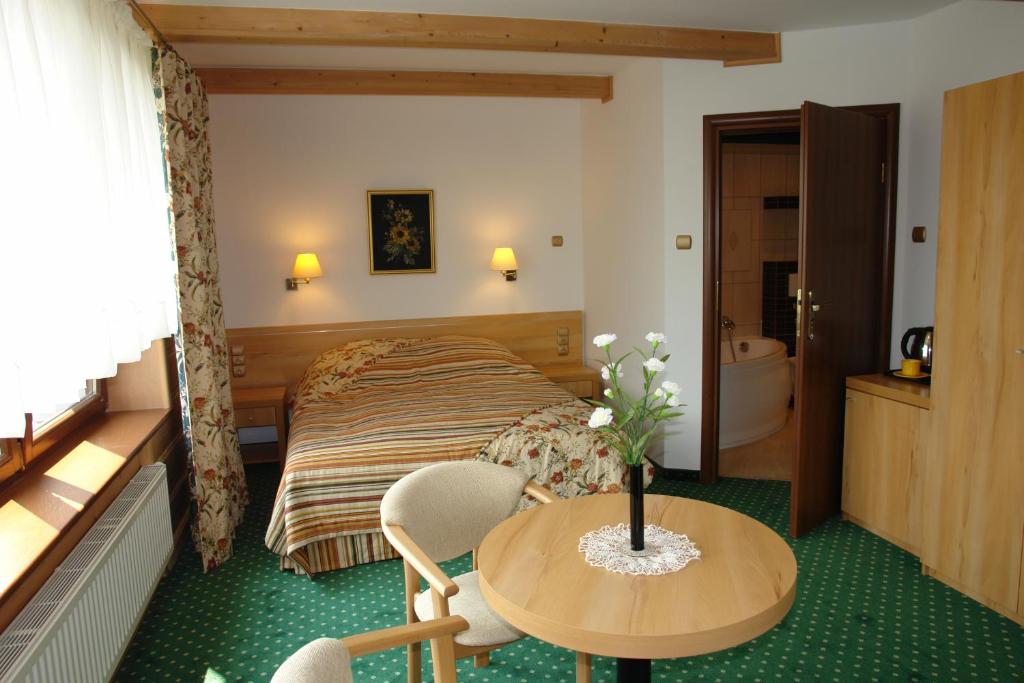 Posteľ alebo postele v izbe v ubytovaní Willa Panorama SPA