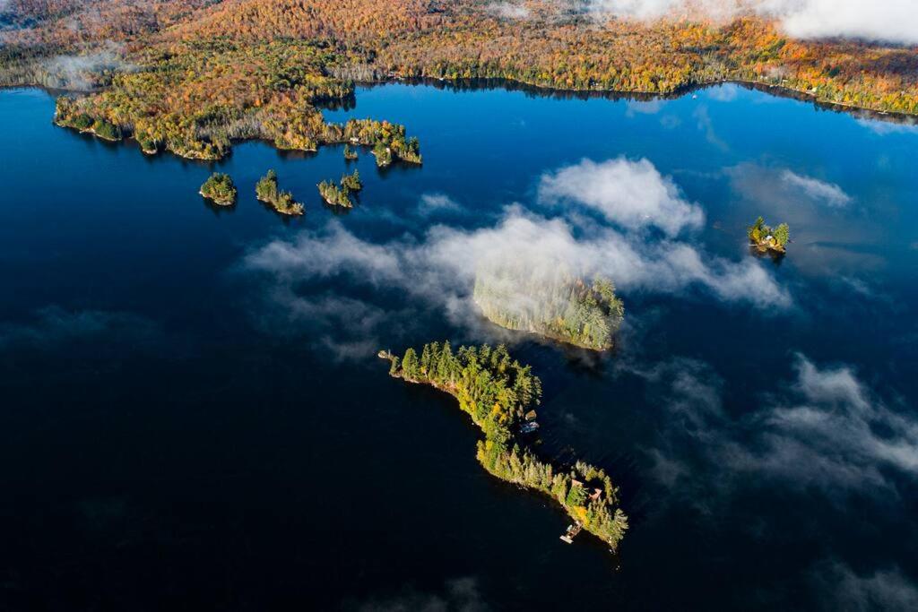 an island in the middle of a large body of water at Algonquin Island 'Luxe' Cottage at the edge of the Park in South River