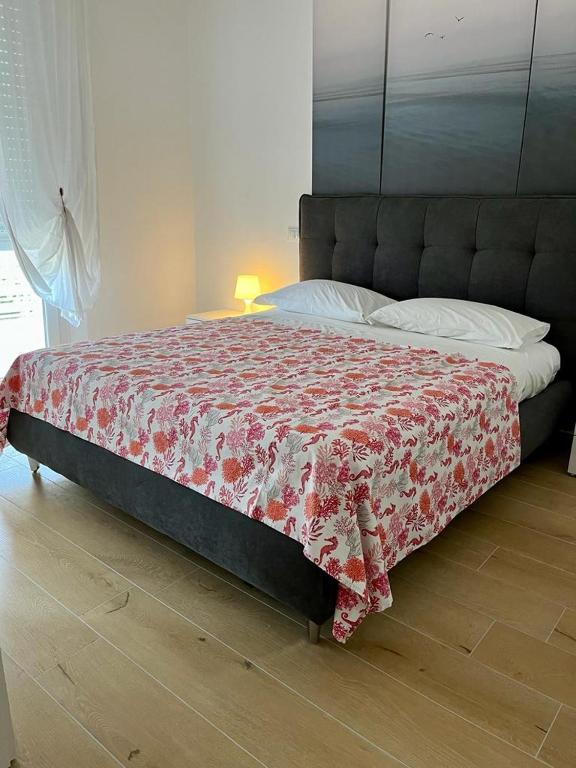Posteľ alebo postele v izbe v ubytovaní Appartamenti Villa Miramare