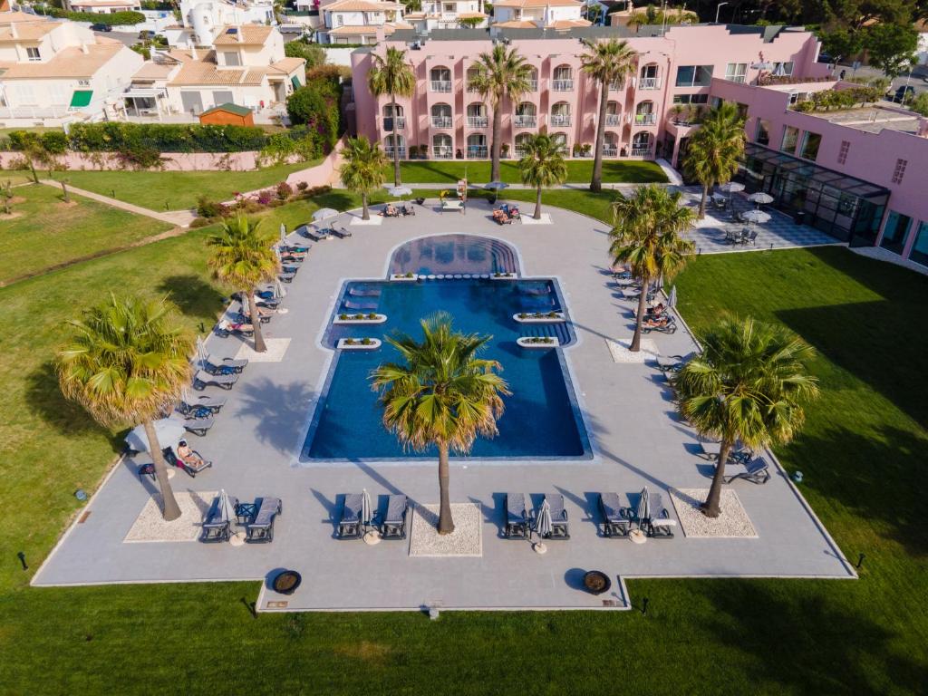 an aerial view of a resort with a swimming pool at Vila Gale Collection Praia in Albufeira