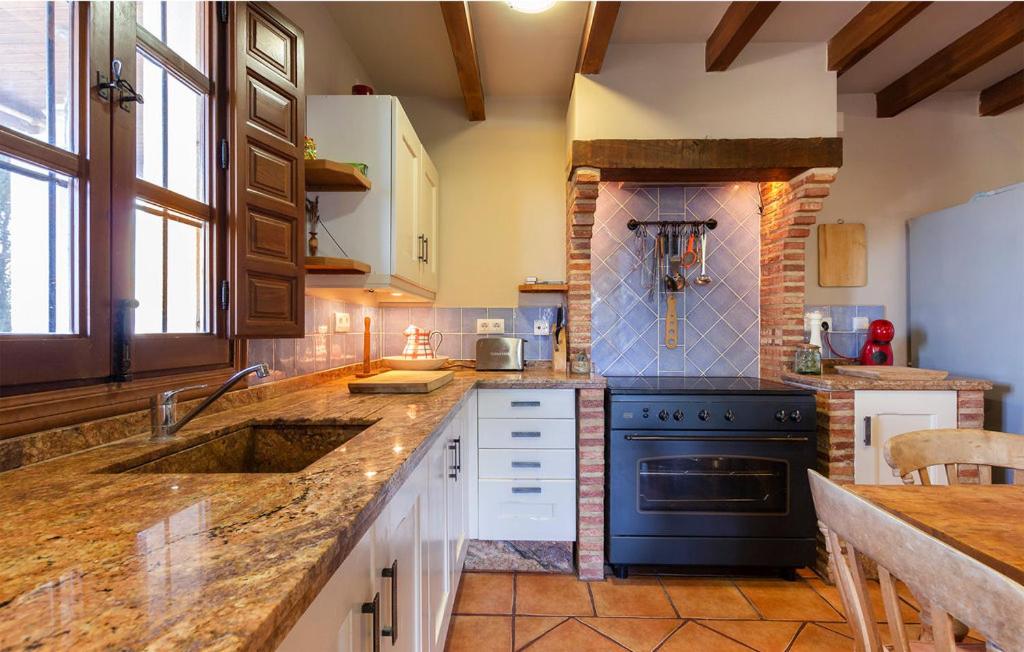 Kuchyň nebo kuchyňský kout v ubytování Casa La Rosa