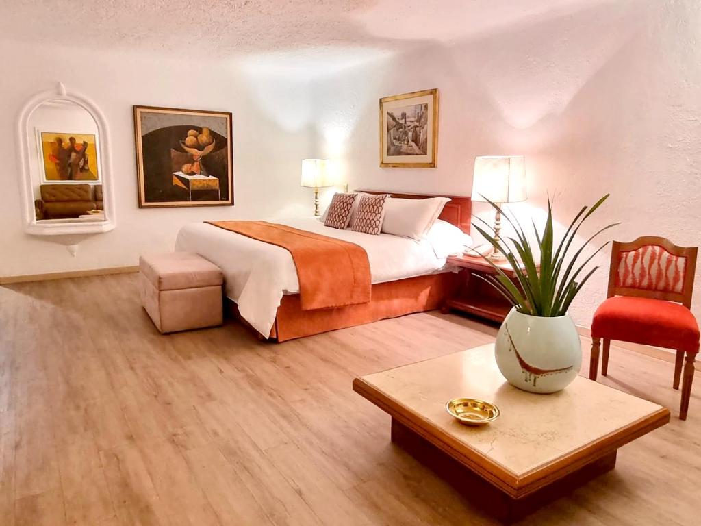 Postel nebo postele na pokoji v ubytování Antara Hotel & Suites - Miraflores