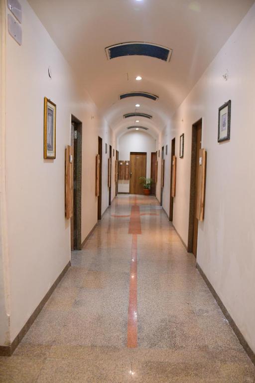 an empty hallway in an office building at Hotel Regency in Amrāvati