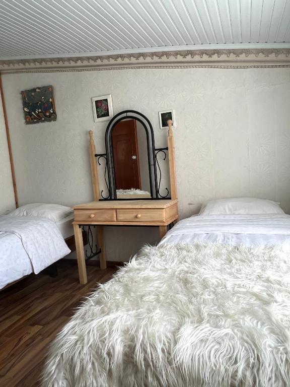 Postel nebo postele na pokoji v ubytování ARTSIV Guesthouse