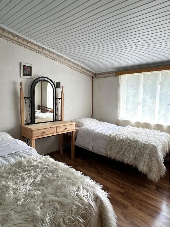 Postel nebo postele na pokoji v ubytování ARTSIV Guesthouse