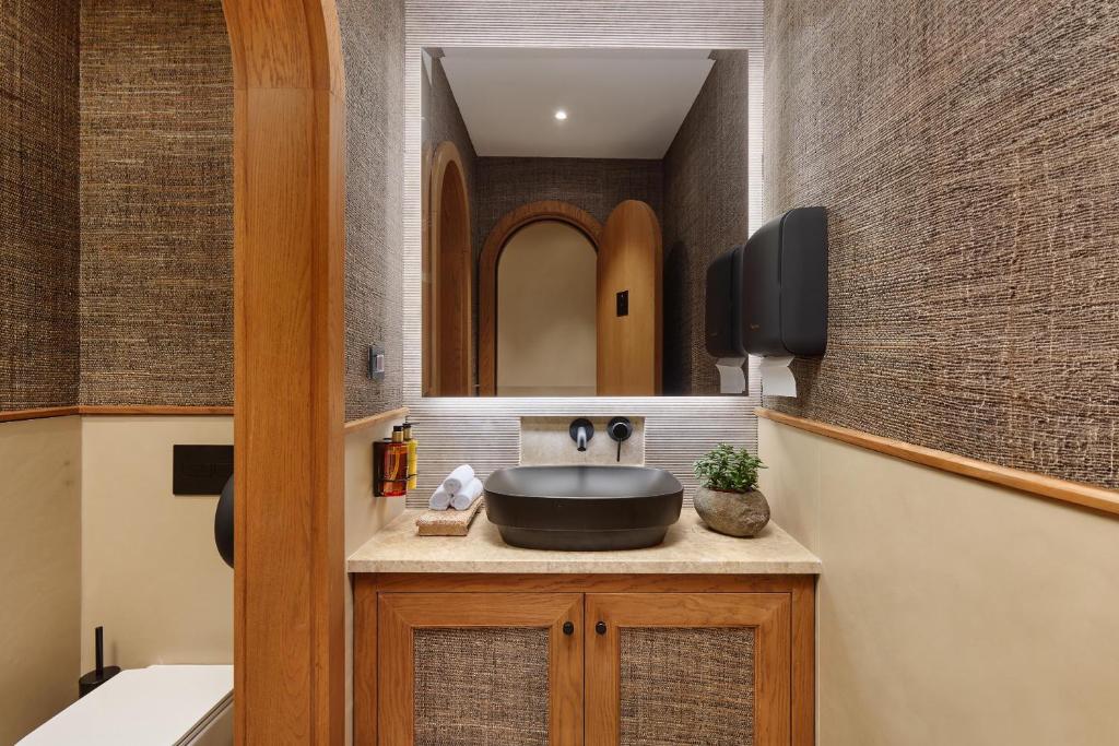 TV a/nebo společenská místnost v ubytování Casa Manor Boutique Hotel