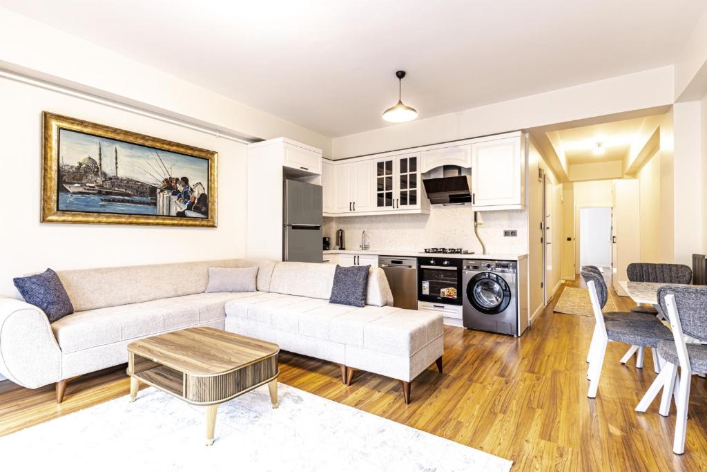 a living room with a couch and a table at Modern Living in Nisantasi Citys Mall in Istanbul