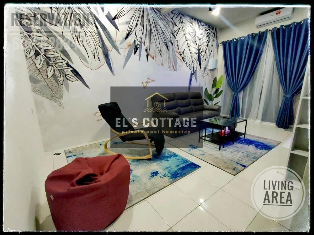 a living room with a couch and a living area at El's Cottage Homestay in Pekan