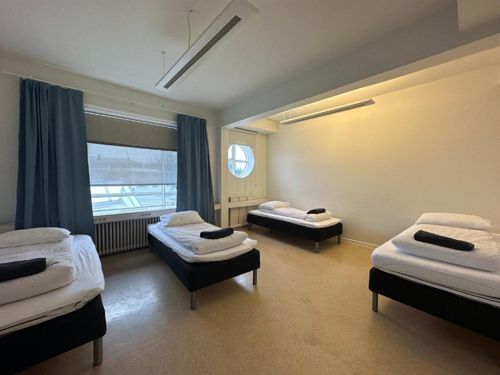 Postel nebo postele na pokoji v ubytování Baron's Hostel