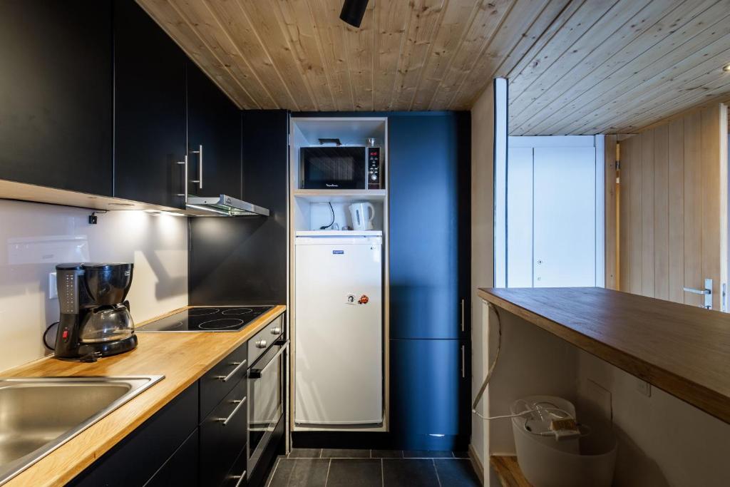 Kuchyň nebo kuchyňský kout v ubytování Superbe appartement, en 2 parties, au centre d'Anzère