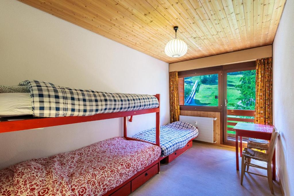 Postel nebo postele na pokoji v ubytování Superbe appartement, en 2 parties, au centre d'Anzère