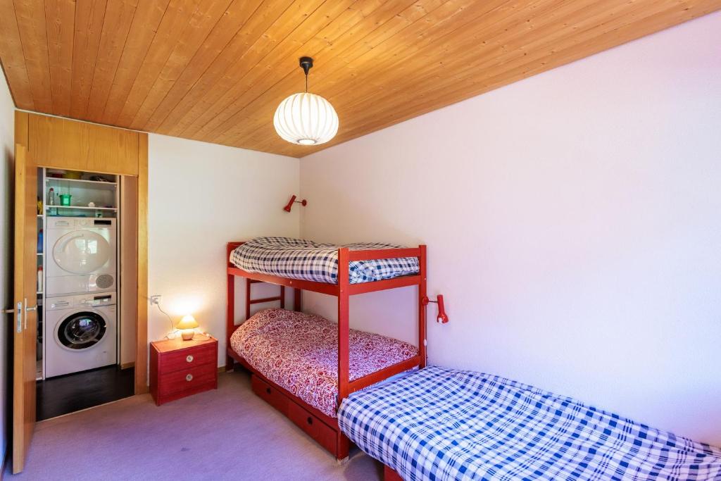 Postel nebo postele na pokoji v ubytování Superbe appartement, en 2 parties, au centre d'Anzère