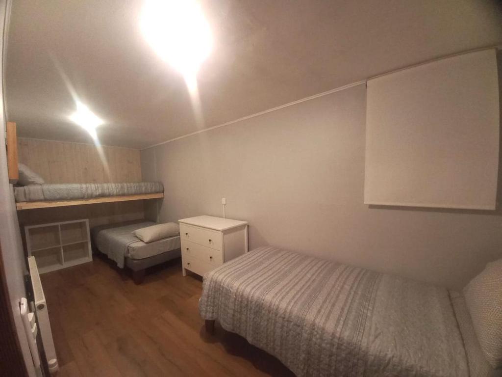 Voodi või voodid majutusasutuse Lodge Andes toas