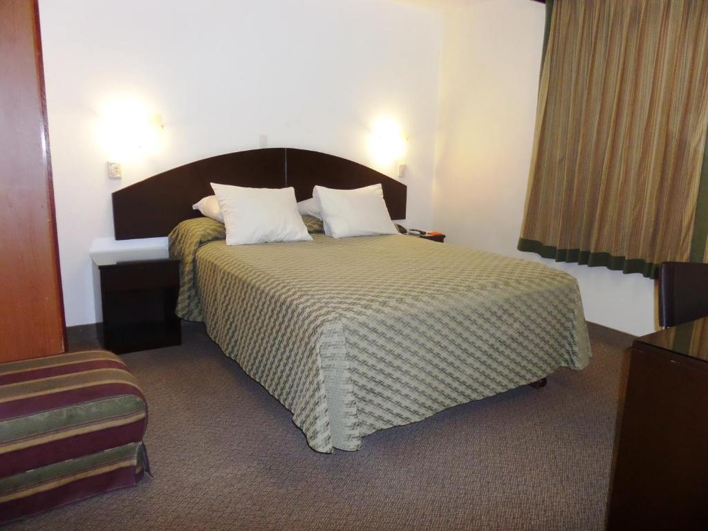 En eller flere senge i et værelse på Intiotel Chiclayo