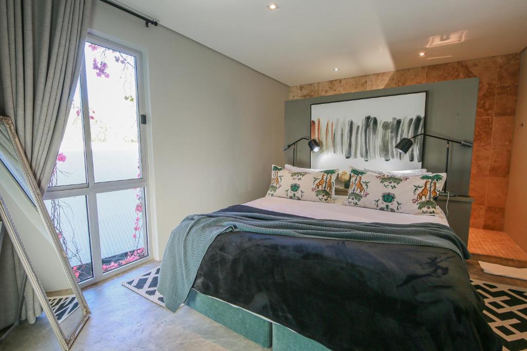 Una cama o camas en una habitación de Suite 9 The Village