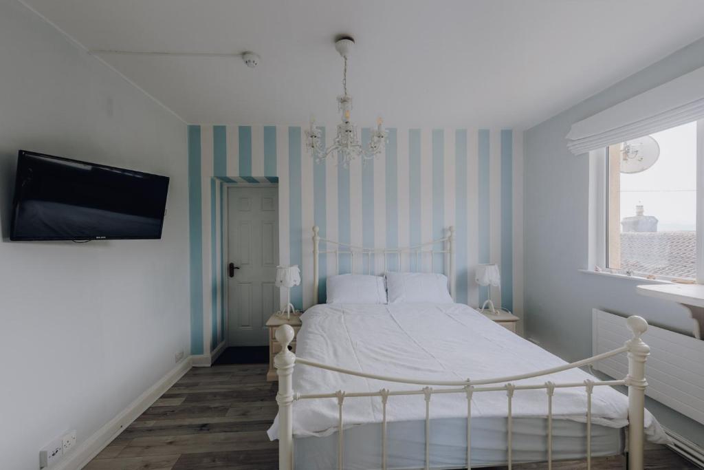Postel nebo postele na pokoji v ubytování Sligo Bay Lodge