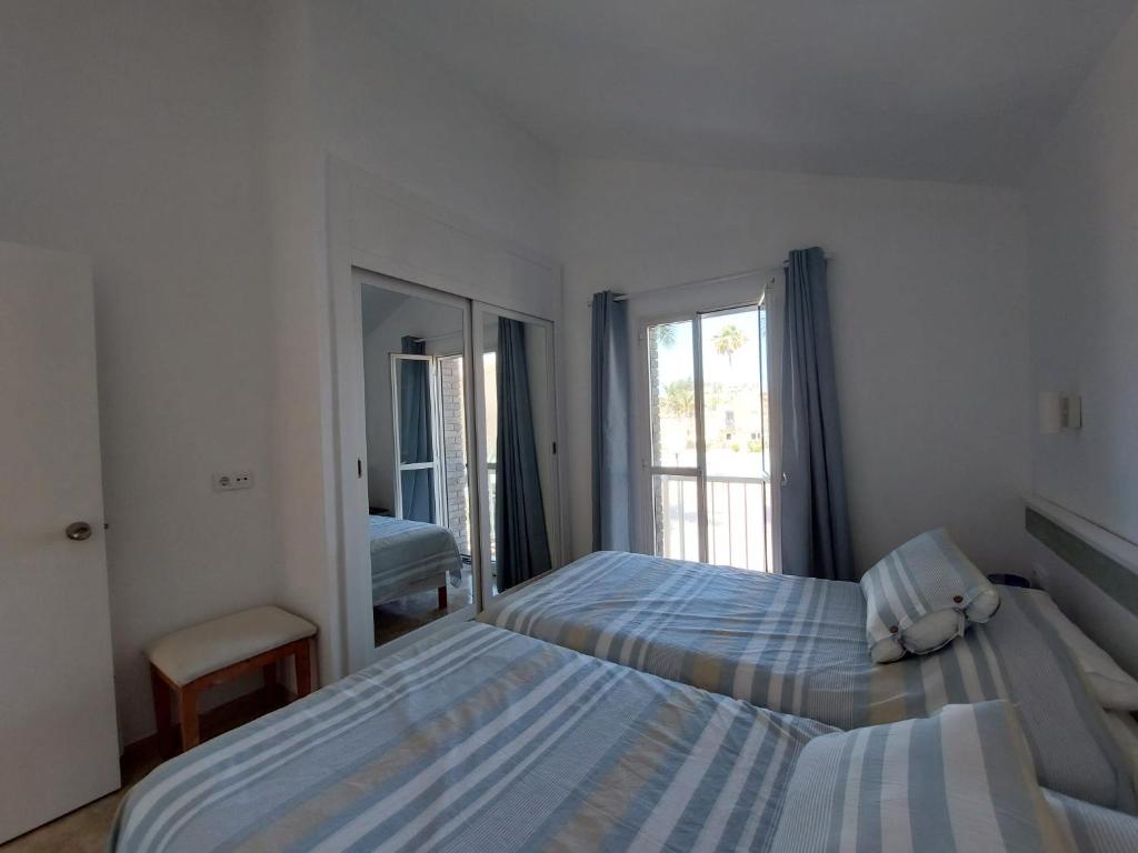 Postel nebo postele na pokoji v ubytování Bungalow FELUCIA