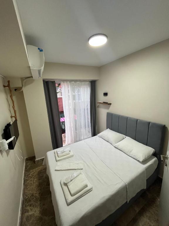 Postel nebo postele na pokoji v ubytování Ada Antik 2