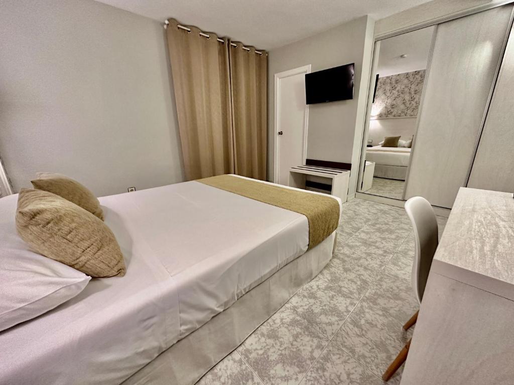 Postel nebo postele na pokoji v ubytování Hotel El Paraíso