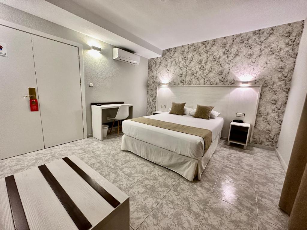 Postel nebo postele na pokoji v ubytování Hotel El Paraíso