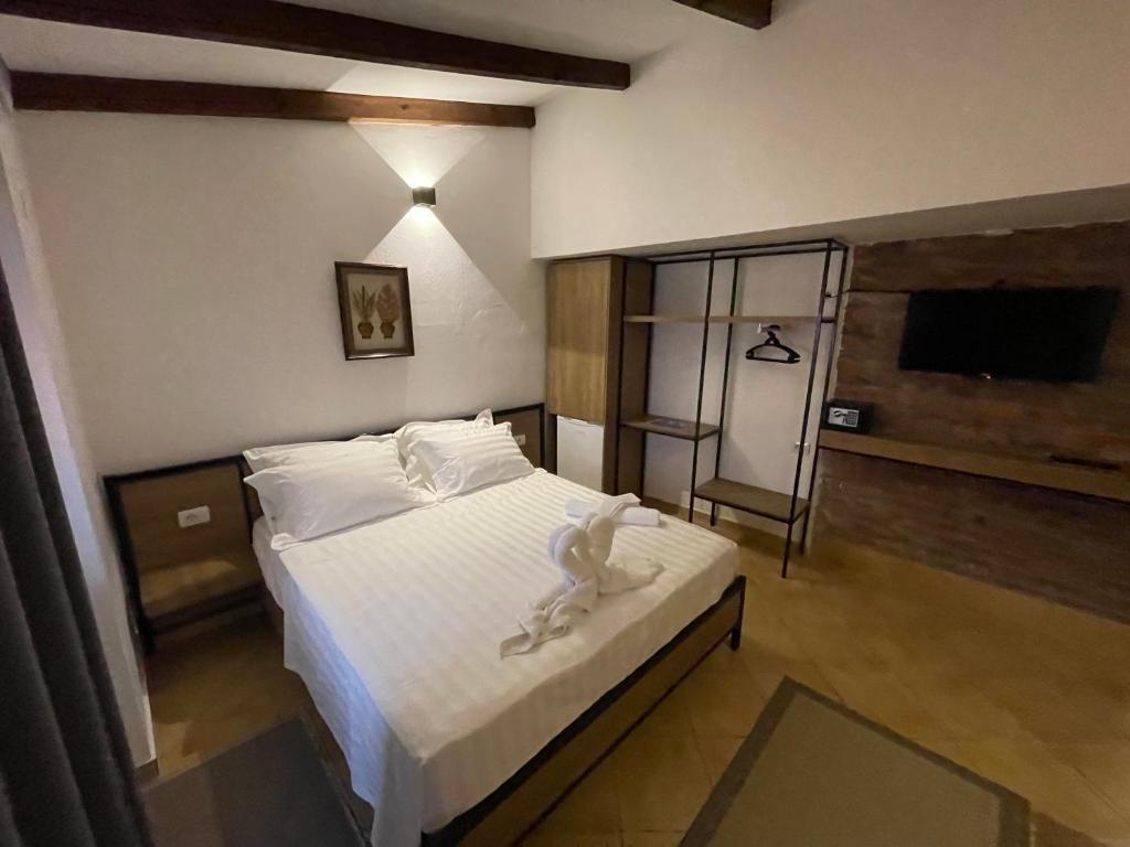 Postel nebo postele na pokoji v ubytování Hotel Kappa3 Villas
