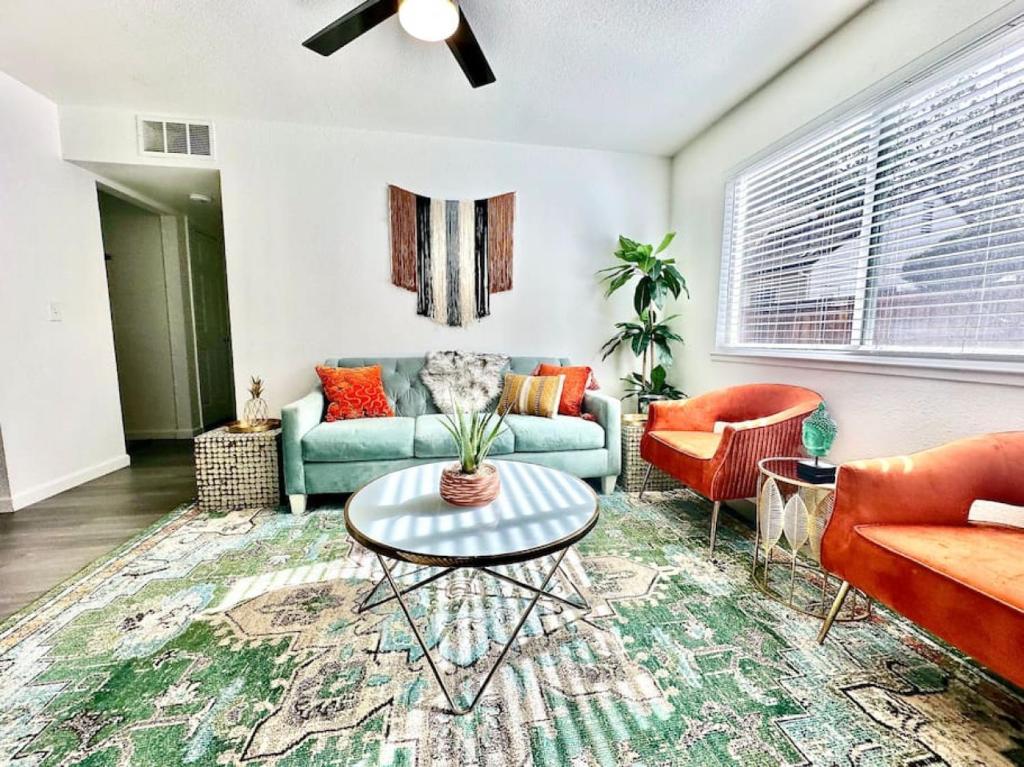 a living room with a couch and a table at First floor gated, central and remodeled apartment in Sacramento
