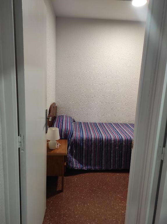 Postel nebo postele na pokoji v ubytování Apartamentos Can Bruguera 4