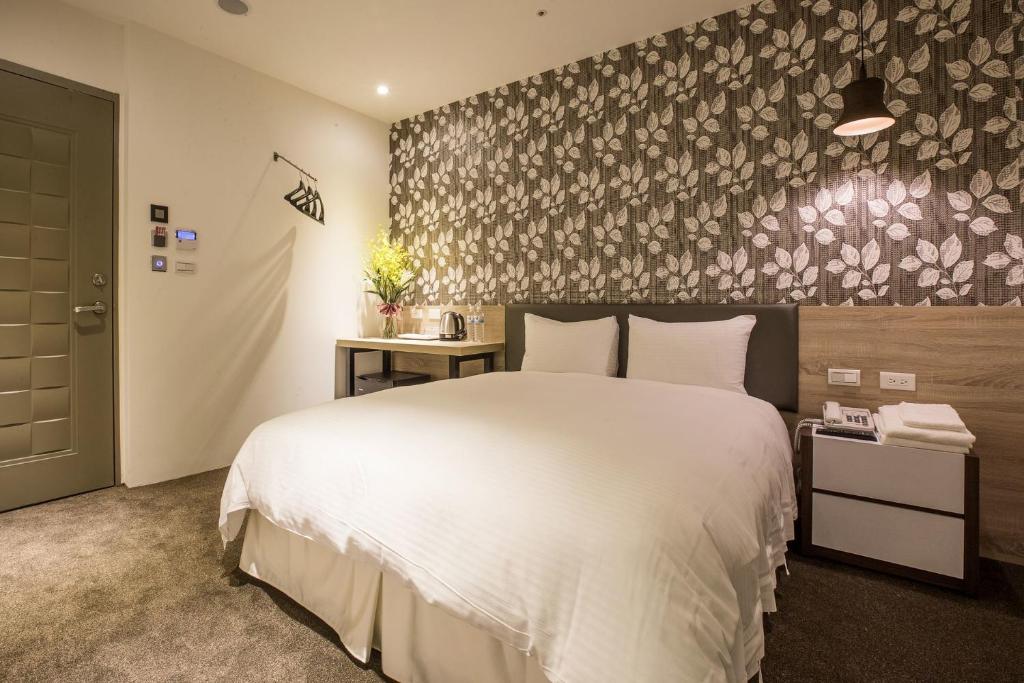 Postel nebo postele na pokoji v ubytování Queens Hotel II