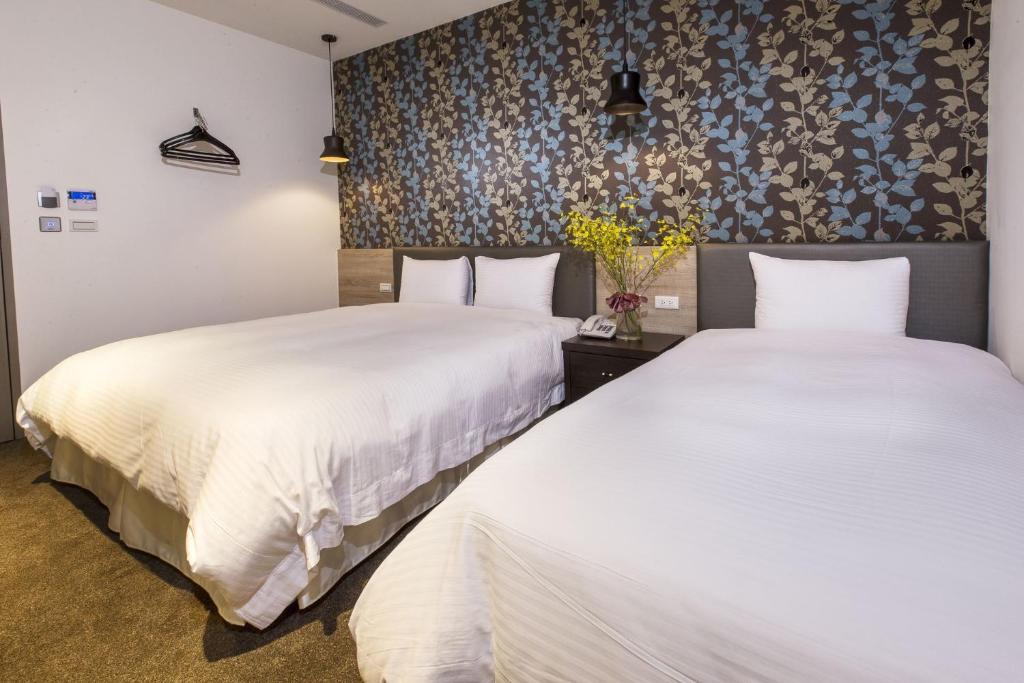 Postel nebo postele na pokoji v ubytování Queens Hotel II
