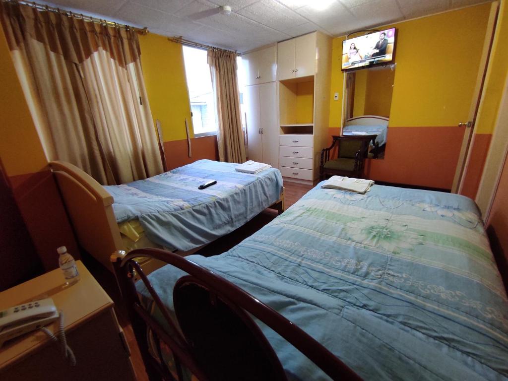 Postel nebo postele na pokoji v ubytování HOTEL CARIBEAN REAL