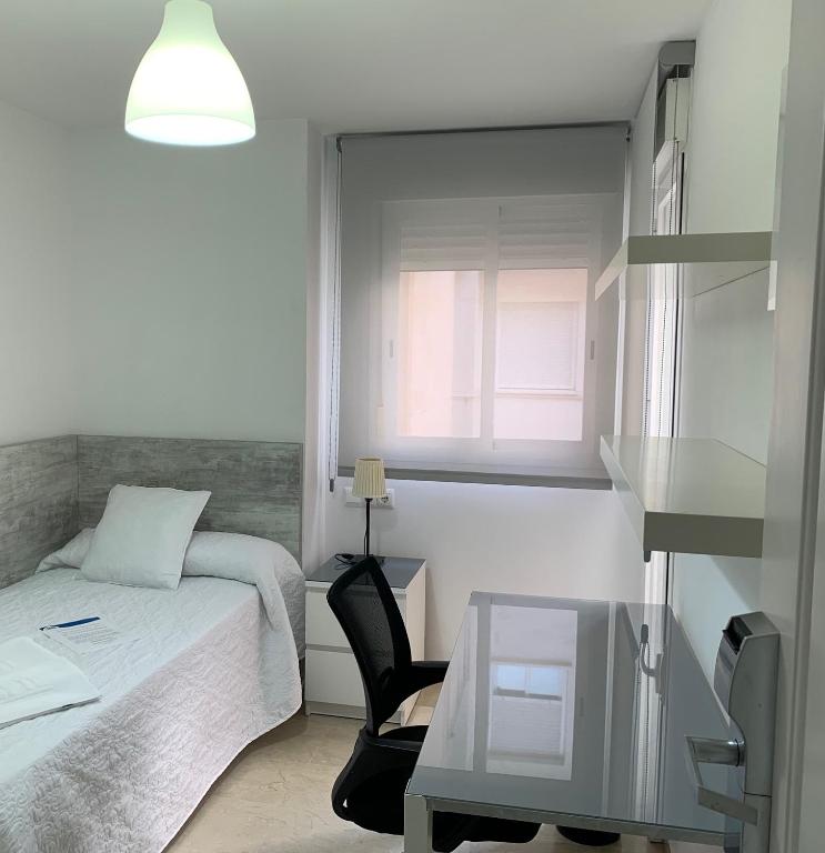 Postel nebo postele na pokoji v ubytování Hostel Residencia Alfil