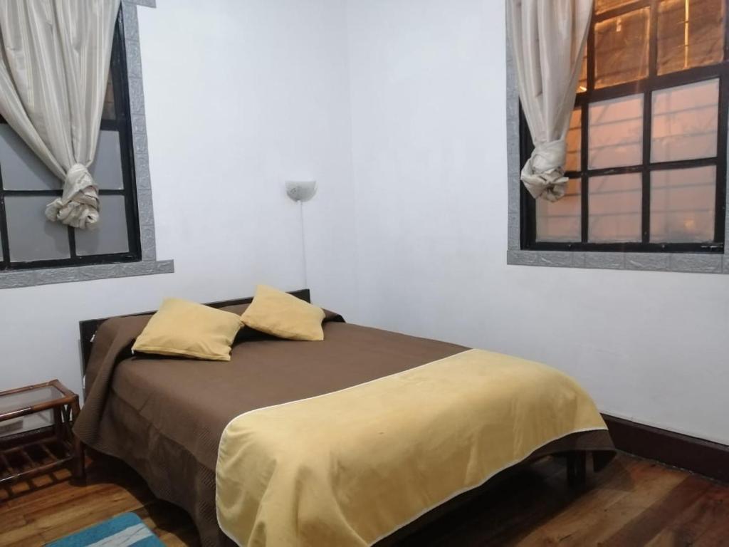 Postel nebo postele na pokoji v ubytování Galapagos Natural Life Hostel