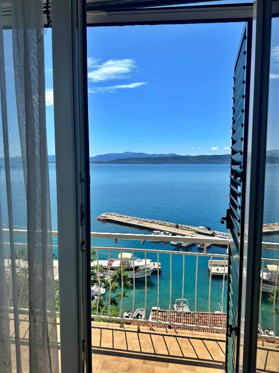 a view from a window of a marina at Apartments Majstrovic in Živogošće
