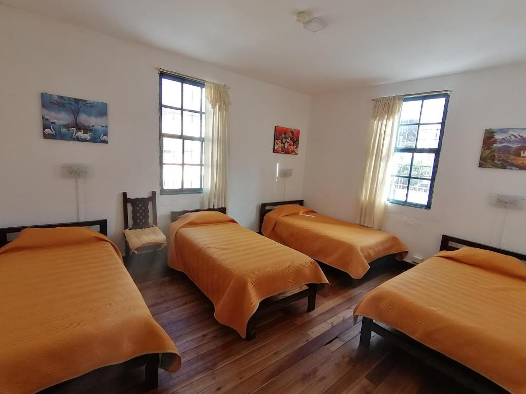 Postel nebo postele na pokoji v ubytování Galapagos Natural Life Hostel