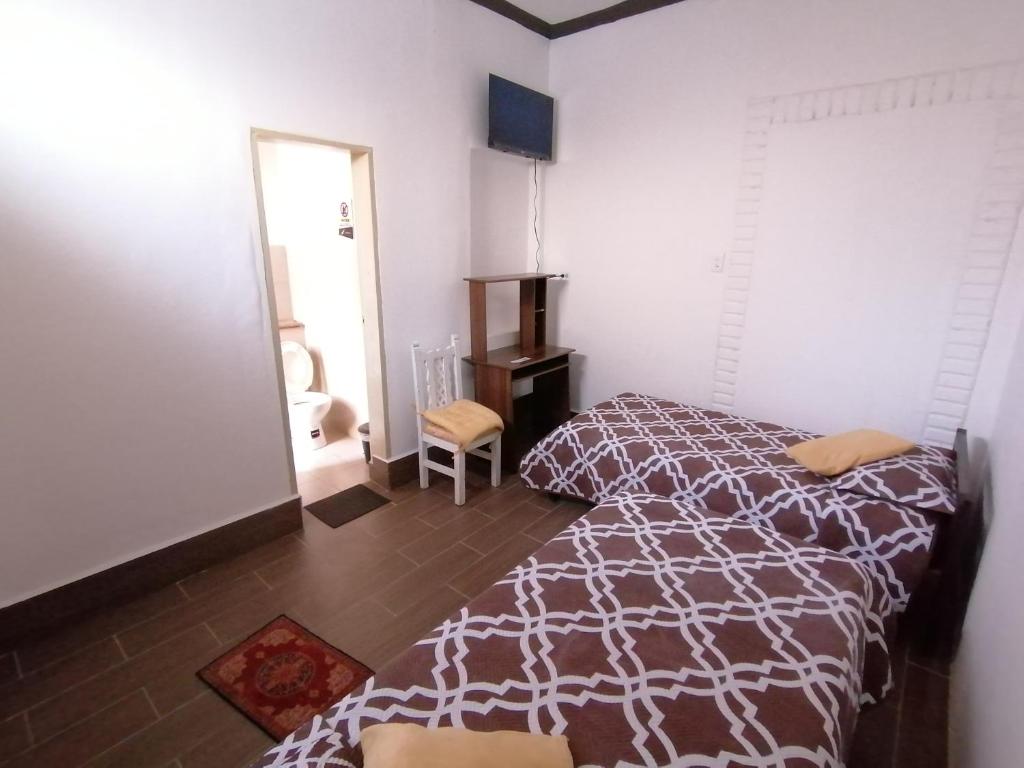 Postel nebo postele na pokoji v ubytování Galapagos Natural Life Hostel