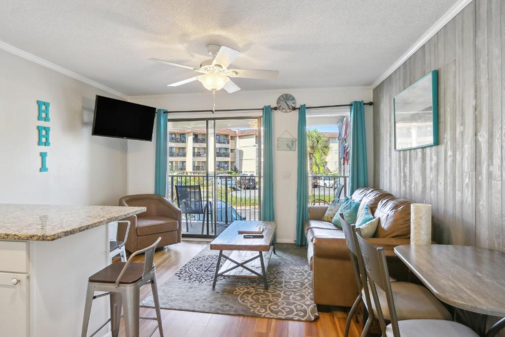 a living room with a couch and a table at Hilton Head Vacation Rental Private Beach Access! in Hilton Head Island