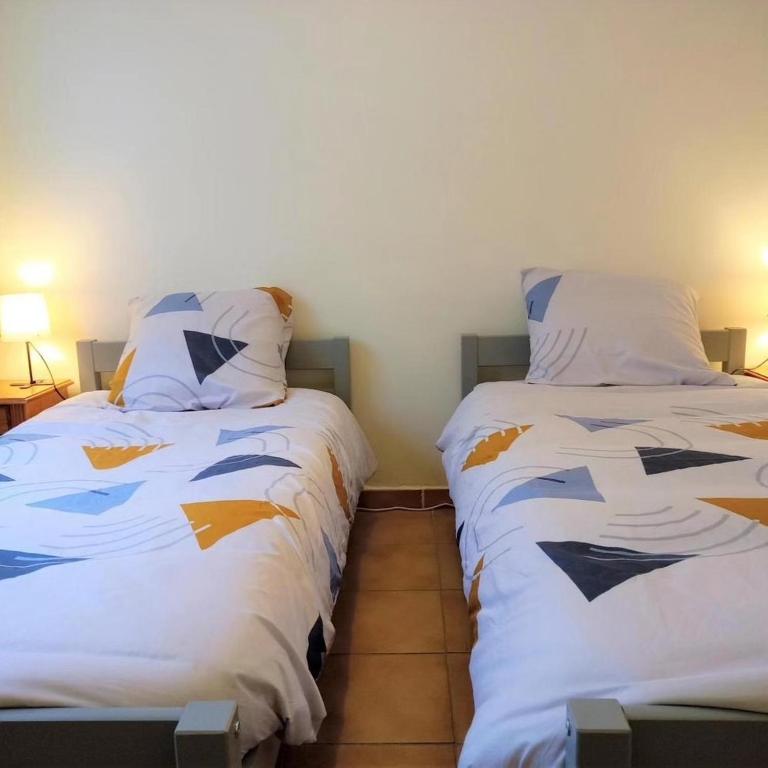 Postel nebo postele na pokoji v ubytování Gîte du petit chemin