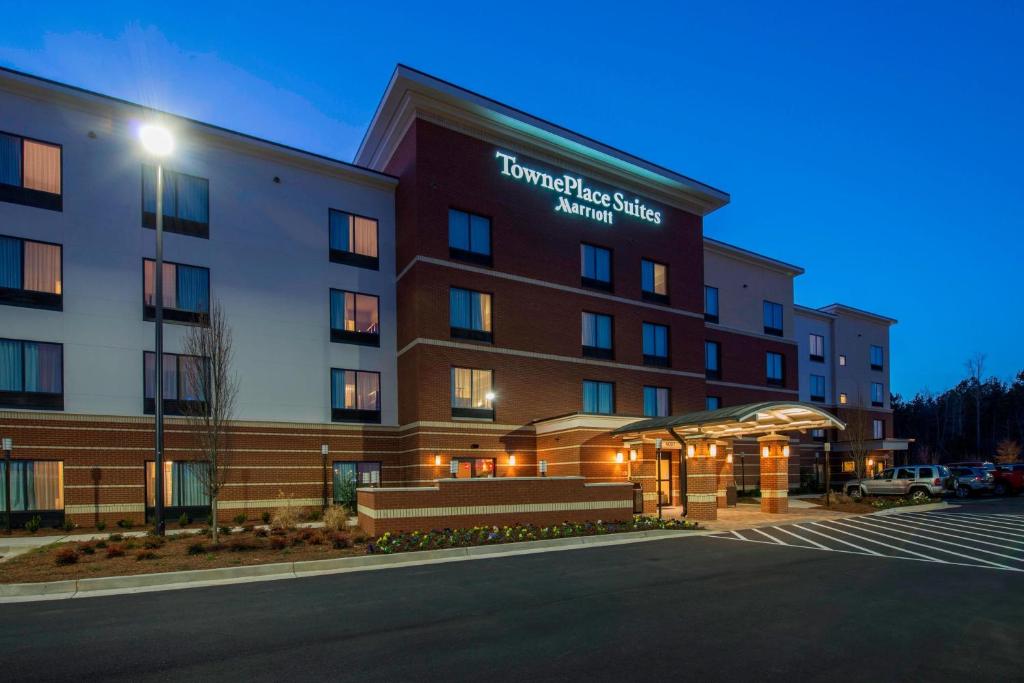 a hotel with a parking lot in front of it at TownePlace Suites by Marriott Newnan in Newnan