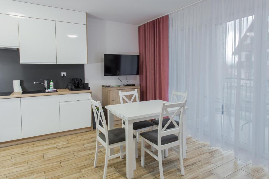 Kuchyňa alebo kuchynka v ubytovaní K2 Apartamenty
