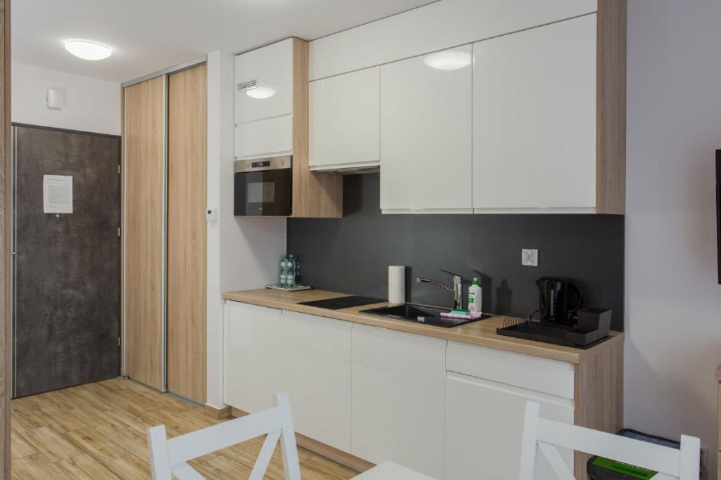 Kuchyňa alebo kuchynka v ubytovaní K2 Apartamenty