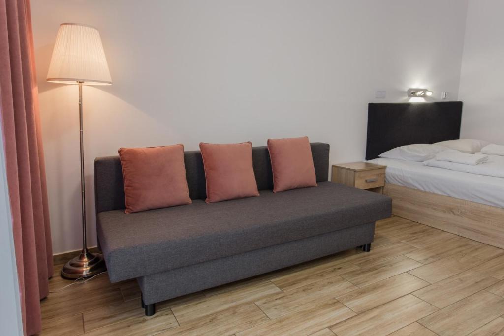 Posteľ alebo postele v izbe v ubytovaní K2 Apartamenty
