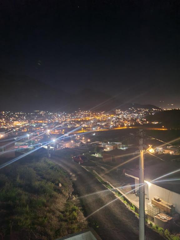 a view of a city at night with lights at Lux apartmani Anastasija in Sutomore