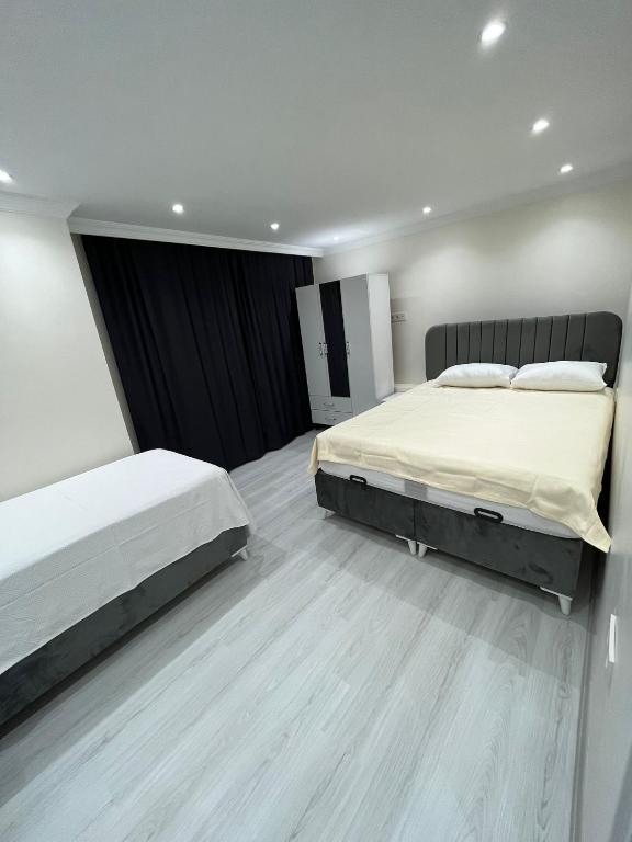 Postel nebo postele na pokoji v ubytování CEM OTEL
