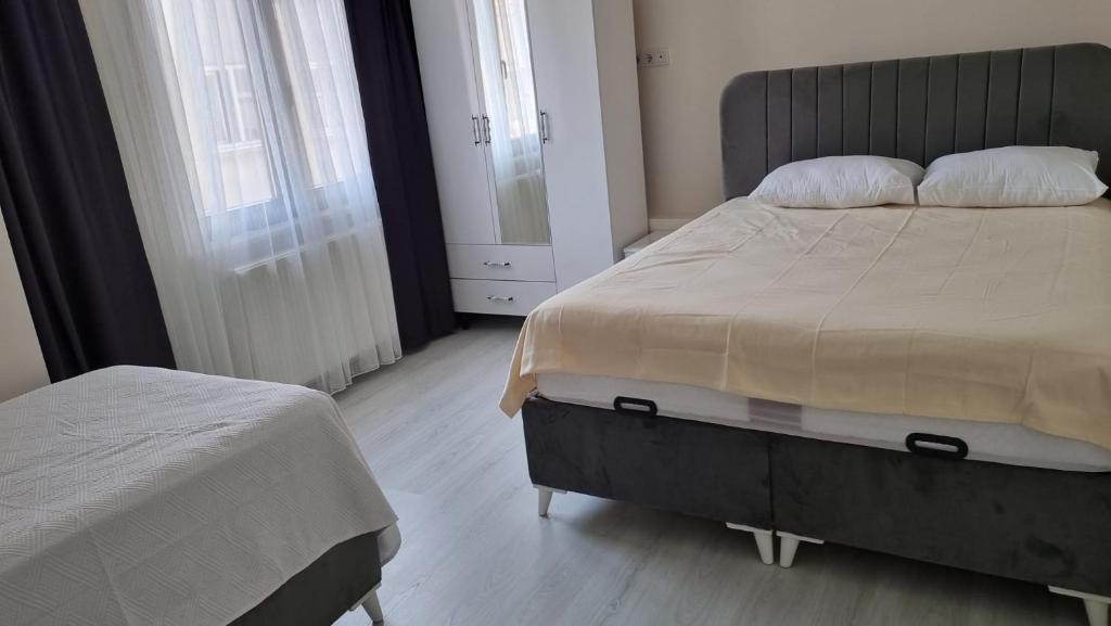 Postel nebo postele na pokoji v ubytování CEM OTEL