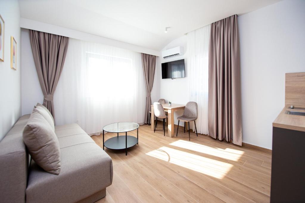 TV o dispositivi per l'intrattenimento presso Apartments Sirena - Modern stay with free parking